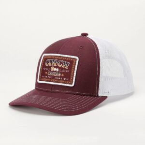 A maroon and white hat with a patch on it.