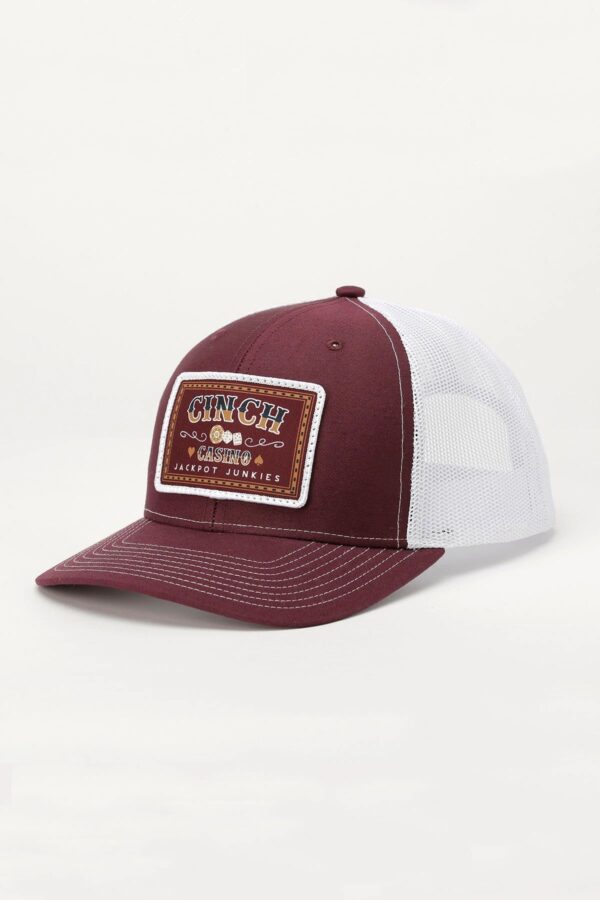 A maroon and white hat with a patch on it.