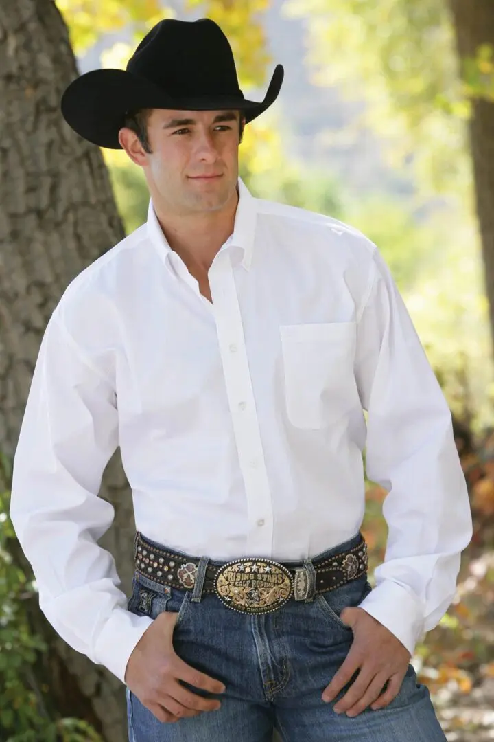 A man in white shirt and cowboy hat.