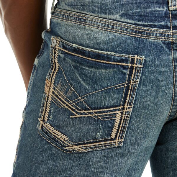 A close up of the back pocket on a pair of jeans.