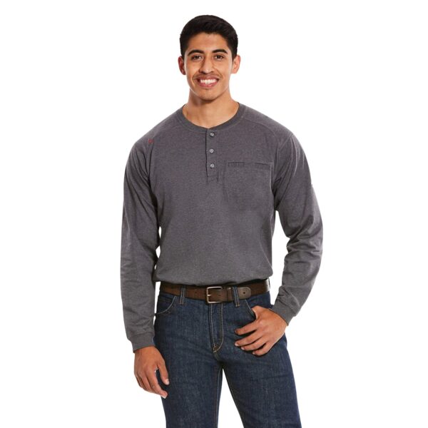 A man wearing jeans and a long sleeve shirt.