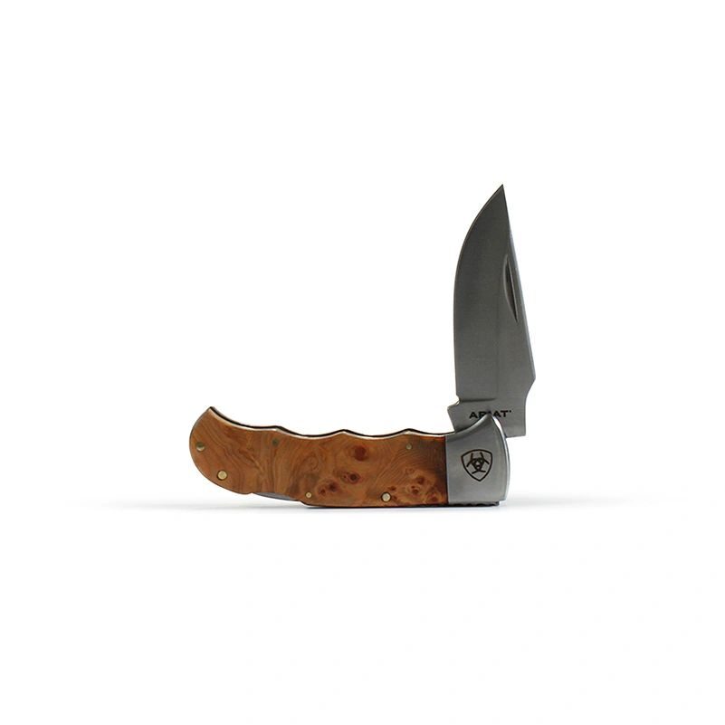 A knife with a wooden handle on top of it.