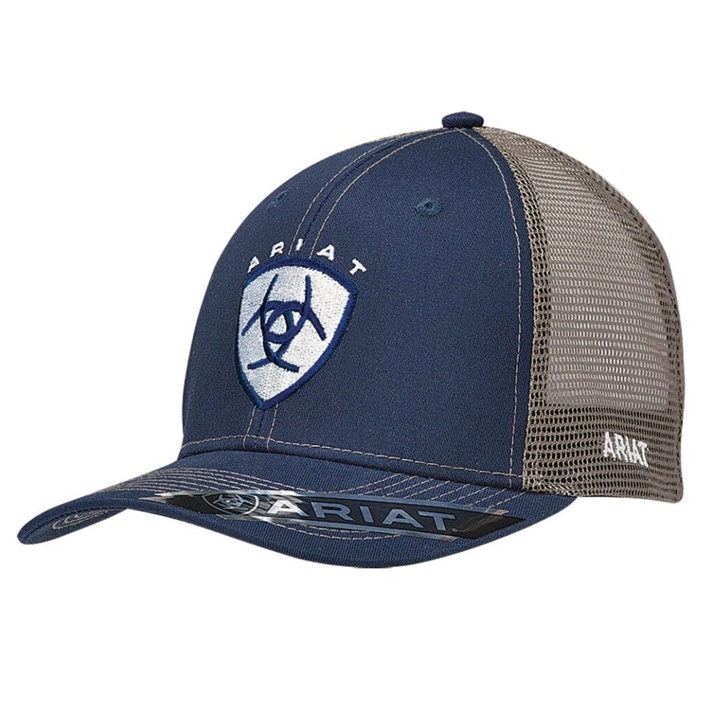 A blue and gray hat with the initials of a rider.