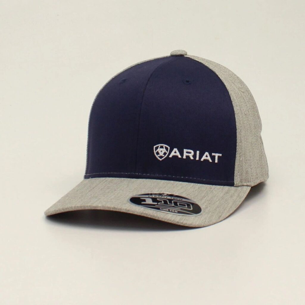 A navy and gray hat with the word ariat on it.