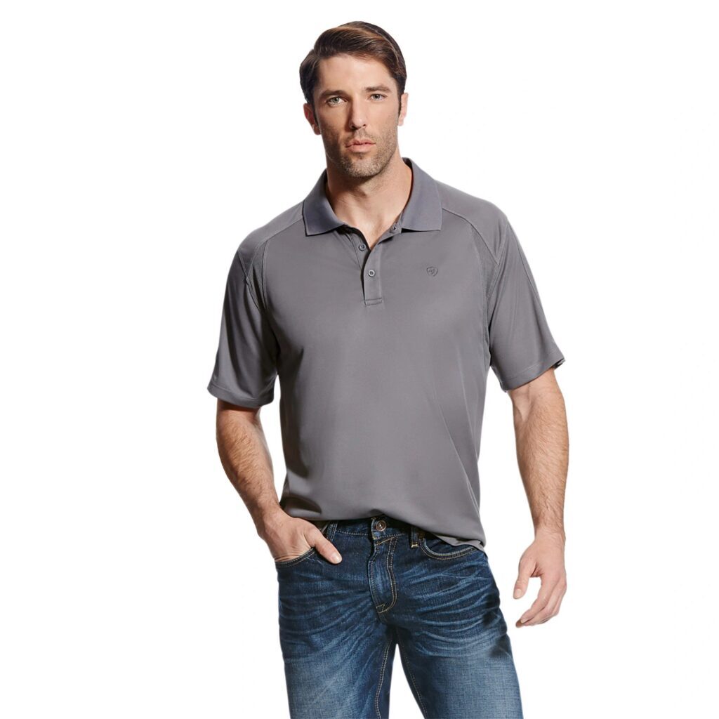 A man in jeans and grey shirt posing for the camera.