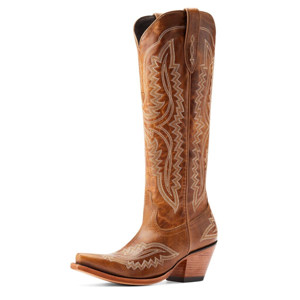 A pair of cowboy boots with a brown pattern on them.